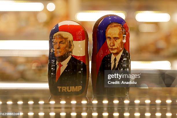 Painted Matryoshka dolls, or known as Russian nesting dolls, bearing the faces of Russian President Vladimir Putin and President-elect Donald Trump...