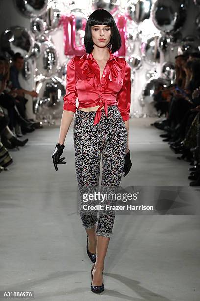 Model walks the runway at the Lena Hoschek show during the Mercedes-Benz Fashion Week Berlin A/W 2017 at Kaufhaus Jandorf on January 17, 2017 in...