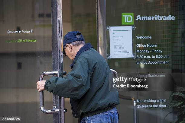 Customer enters a TD Ameritrade Holding Corp. Location in San Francisco, California, U.S., on Friday, Jan. 13, 2017. TD Ameritrade Holding Corp. Is...