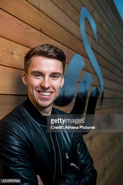 Tom Carroll smiles after signing a contract with Swansea City at The Fairwood Training Ground on January 16, 2017 in Swansea, Wales.