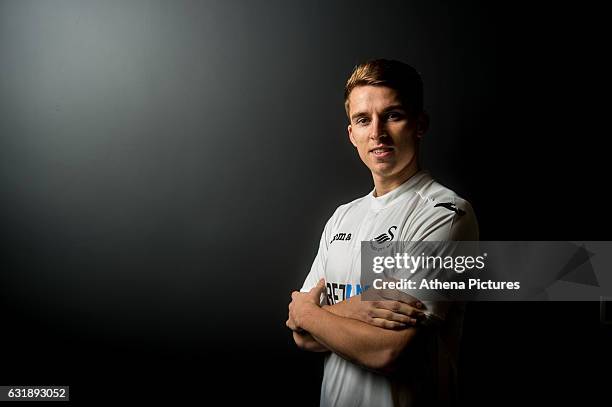 Tom Carroll smiles after signing a contract with Swansea City at The Fairwood Training Ground on January 16, 2017 in Swansea, Wales.