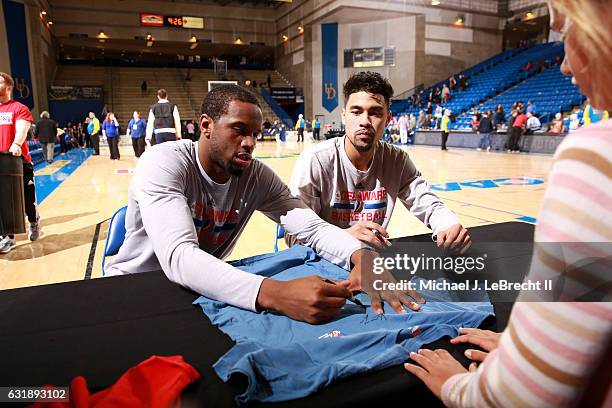 Dionte Christmas and Mikh McKinney of the Delaware 87ers sign autographs after the game against the Erie BayHawks on January 6, 2017 at the Bob...