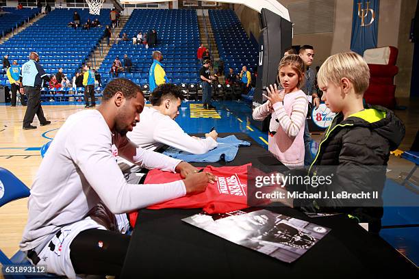 Dionte Christmas and Mikh McKinney of the Delaware 87ers sign autographs after the game against the Erie BayHawks on January 6, 2017 at the Bob...