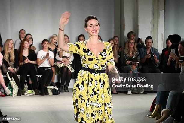 Lena Hoschek acknowledges the applause of the audience after her show during the Mercedes-Benz Fashion Week Berlin A/W 2017 at Kaufhaus Jandorf on...