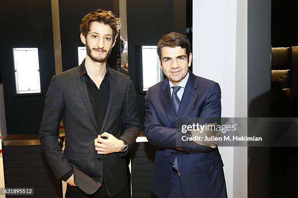 MontBlanc CEO Jerome Lambert and Pierre Niney are pictured during their visit of the Montblanc Booth At SIHH as part of the 27th Salon International...