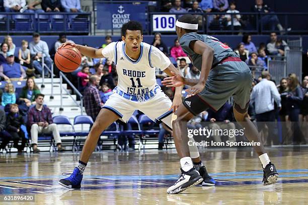 UMass Minutemen guard Dejon Jarreau defends Rhode Island Rams guard Jeff Dowtin during the first half of an NCAA basketball game between UMass...