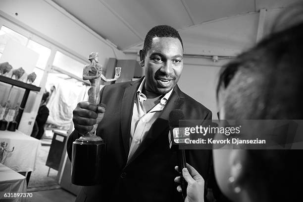 Actor Mykelti Williamson poses at the pouring of the actor statuette for the 23rd Annual Screen Actors Guild Awards at American Fine Arts Foundry on...