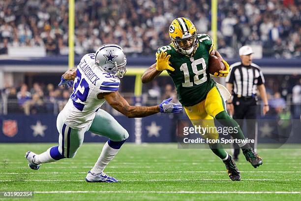 Green Bay Packers wide receiver Randall Cobb makes a reception with Dallas Cowboys cornerback Orlando Scandrick defending during the NFC Divisional...