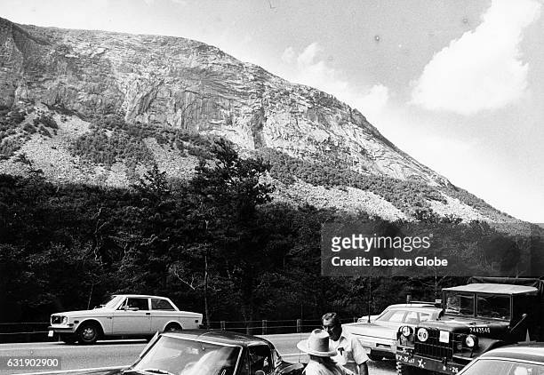 Cars cluster on Route 3 in Franconia, N.H., near the base of Cannon Mountain in the White Mountains on Aug. 12 where rescue workers were working to...