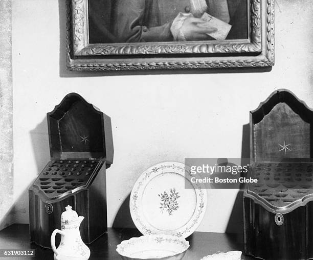 John and Abigail Adams' mahogany silverware cases and white-and rose-trimmed china set in the Old House at Peace field in Quincy, Mass., Aug. 27,...