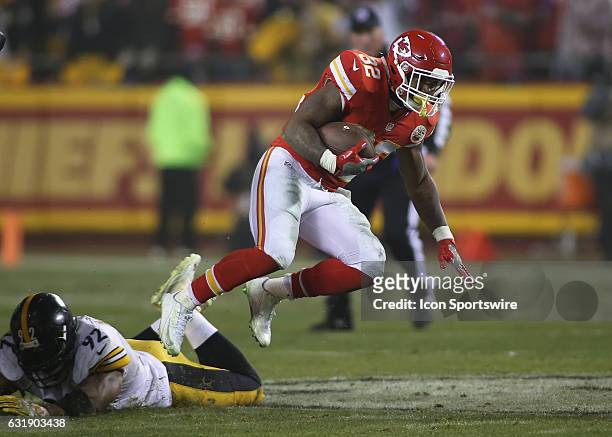 Kansas City Chiefs running back Spencer Ware hops over Pittsburgh Steelers outside linebacker James Harrison in the fourth quarter of the AFC...