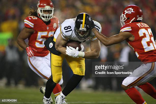 Pittsburgh Steelers tight end Jesse James runs after the catch while Kansas City Chiefs cornerback Marcus Peters tries to tackle him in the first...