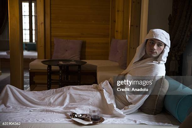 Man lies in a room after having bath, in the Haseki Hurrem Sultan Hamam, Istanbul, Turkey on January 17, 2017. The Haseki Hurrem Sultan Hamam which...