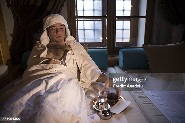 Man lies in a room after having bath, in the Haseki Hurrem Sultan Hamam, Istanbul, Turkey on January 17, 2017. The Haseki Hurrem Sultan Hamam which...