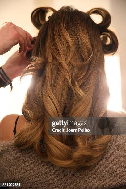 Model is seen backstage ahead of the Riani show during the Mercedes-Benz Fashion Week Berlin A/W 2017 at Kaufhaus Jandorf on January 17, 2017 in...