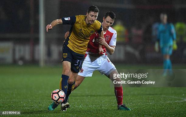 Jens Hegeler of Bristol City is tackled by Eggert Jonsson of Fleetwood during The Emirates FA Cup Third Round Replay between Fleetwood Town and...