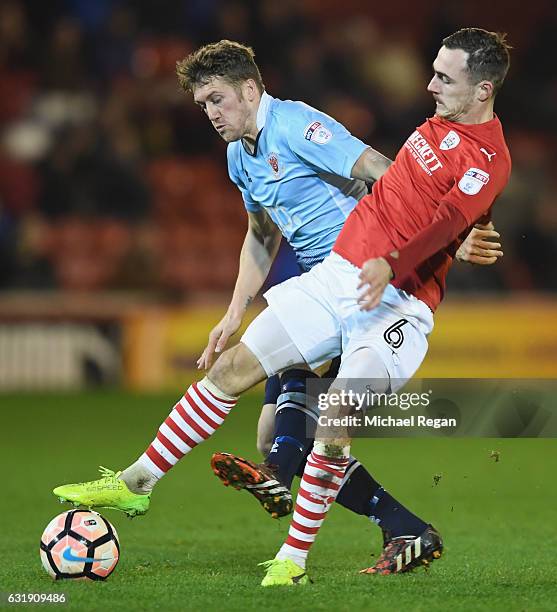 Josh Scowen of Barnsley in action with Jim McAlister of Blackpool during the The Emirates FA Cup Third Round Replay between Barnsley and Blackpool at...