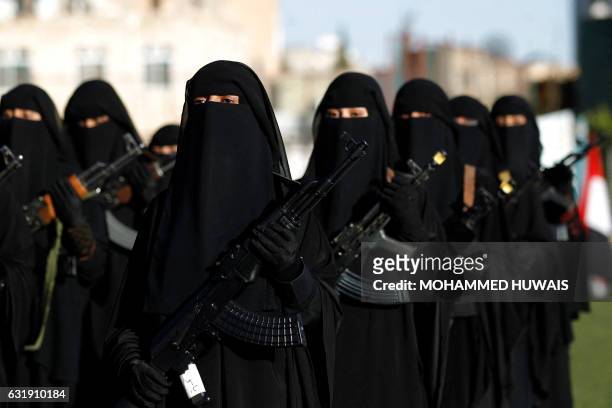 Yemeni female fighters supporting the Shiite Huthi rebels, and carrying weapons used for ceremonial purposes, take part in an anti-Saudi rally in the...