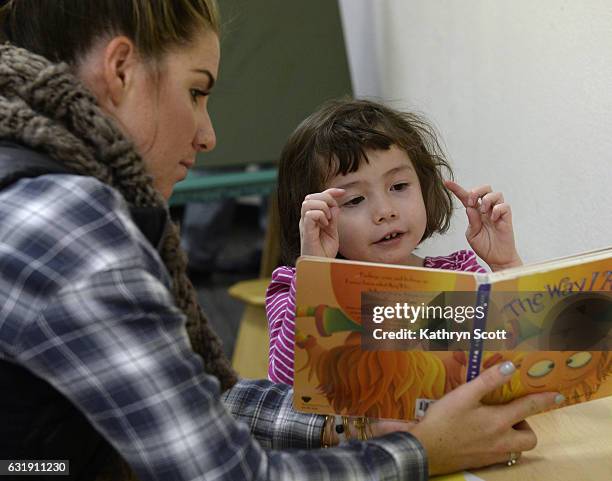 Megan Sheehey, left, works with one student inside the Red Cloud Peak classroom.The Englewood-based Joshua School, highly regarded for its programs...