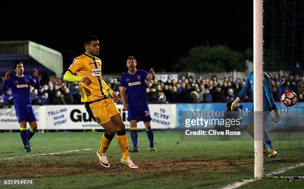 Maxime Biamou of Sutton United scores his sides second goal during the Emirates FA Cup third round replay between AFC Wimbledon and Sutton United at...