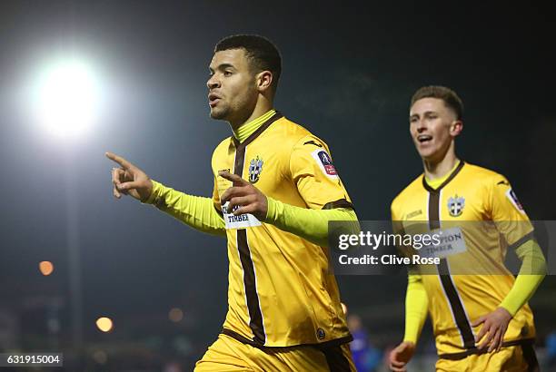 Maxime Biamou of Sutton United celebrates scoring his sides second goal during the Emirates FA Cup third round replay between AFC Wimbledon and...