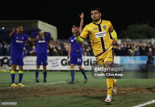 Maxime Biamou of Sutton United celebrates scoring his sides second goal during the Emirates FA Cup third round replay between AFC Wimbledon and...