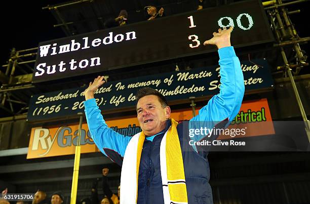 Paul Doswell, Manager of Sutton United celebrates victory after the Emirates FA Cup third round replay between AFC Wimbledon and Sutton United at The...