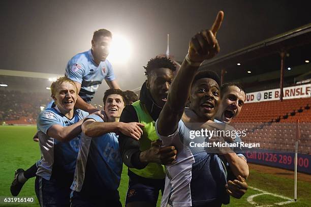 Bright Osayi-Samuel of Blackpool celebrates scoring to make it 2-1 with team mates during the The Emirates FA Cup Third Round Replay between Barnsley...