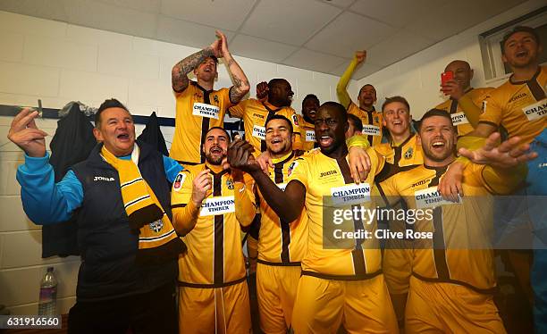 Sutton United team celebrate after the final whistle in the changing room after the Emirates FA Cup third round replay between AFC Wimbledon and...