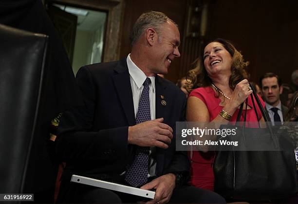 Secretary of Interior nominee, Rep. Ryan Zinke shares a moment with his wife Lolita as he waits to be introduced during his confirmation hearing...