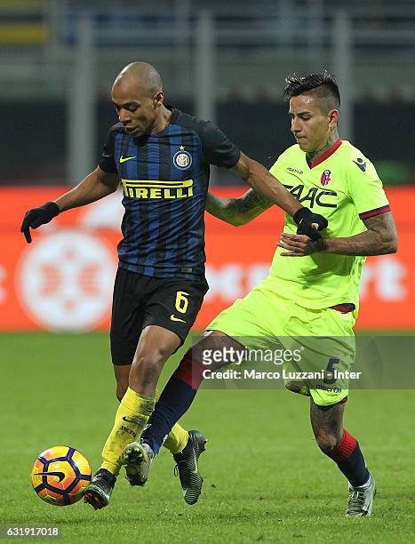 Joao Mario of FC Internazionale competes for the ball with Erick Pulgar of Bologna FC during the TIM Cup match between FC Internazionale and Bologna...