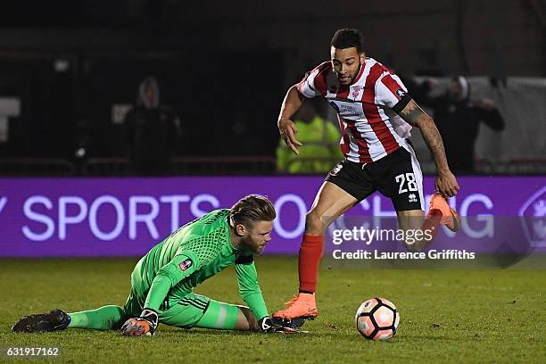 Nathan Arnold of Lincoln City takes the ball around Dean Gerken of Ipswich Town and goes on to score during the Emirates FA Cup third round replay...