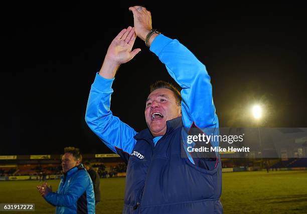 Paul Doswell, Manager of Sutton United celebrates victory after the Emirates FA Cup third round replay between AFC Wimbledon and Sutton United at The...