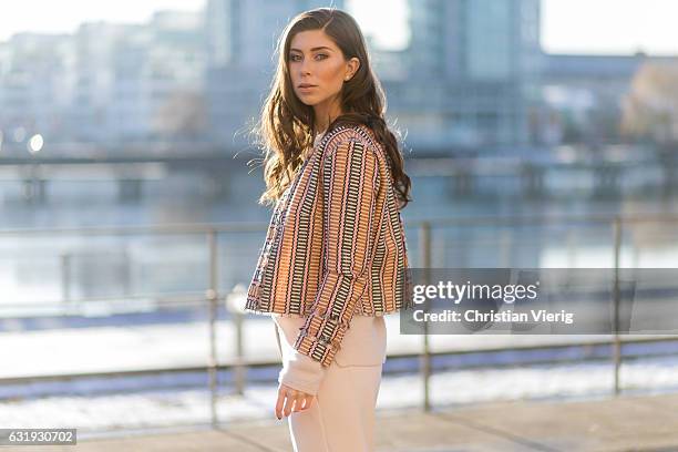 Vicky Heiler wearing a Marc Cain blazer white creme Marc Cain wide leg pants, knit during the Mercedes-Benz Fashion Week Berlin A/W 2017 on January...