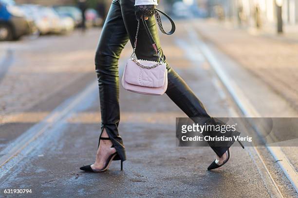 Lisa Hahnbueck wearing a white Marc Cain jacket, grey Marc Cain hoody, pink Marc Cain bag, leather pants, Marc Cain heels, sunglasses during the...