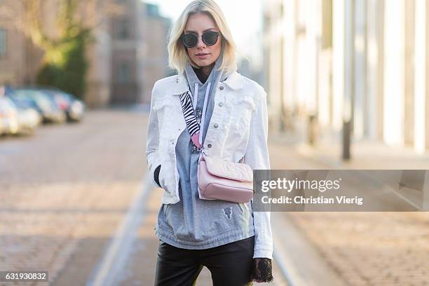 Lisa Hahnbueck wearing a white Marc Cain jacket, grey Marc Cain hoody, pink Marc Cain bag, leather pants, Marc Cain heels, sunglasses during the...