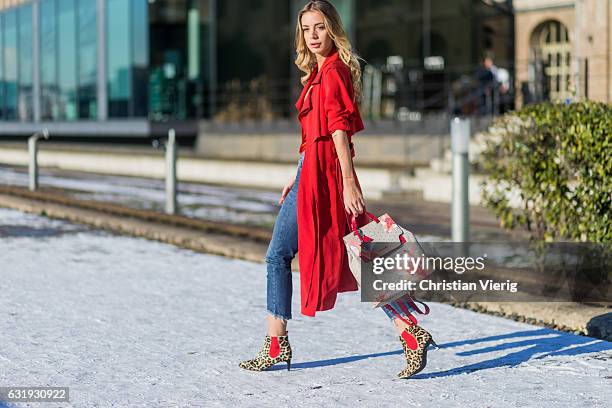 Tatjana Catic wearing a red Marc Cain coat, cropped denim jeans, a Marc Cain backpack, leopard print ankle boots with heel Marc Cain, red silk top...