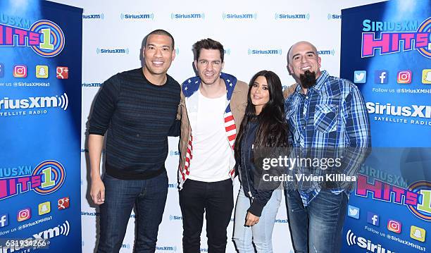 Comedian and radio personality Michael Yo, singer Andy Grammer and radio personalities Symon and Tony Fly visit the Launch of 'Hits 1 in Hollywood'...