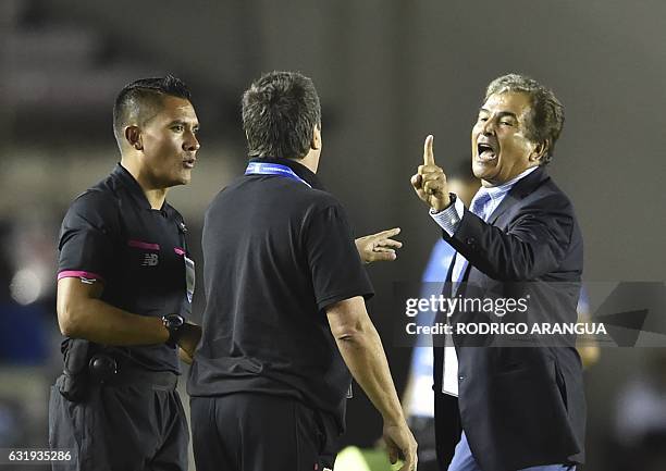 Honduras's coach Jorge Luis Pinto gestures at Hernan Dario Gomez the coach from Panama during the Central American Football Union tournament at...