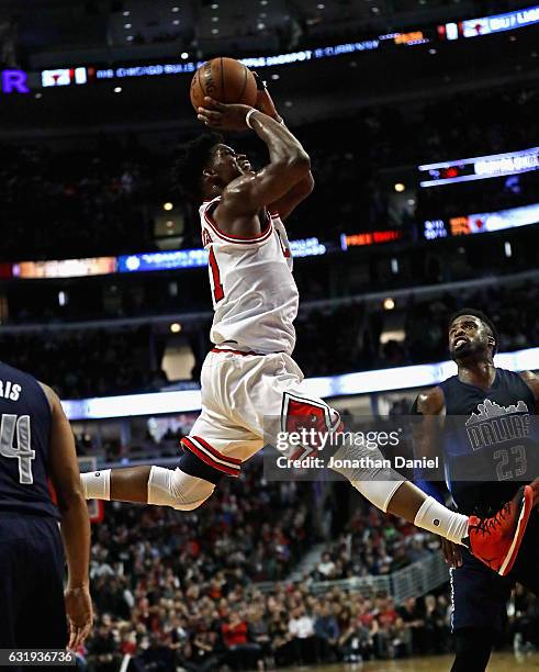 Jimmy Butler of the Chicago Bulls puts up a shot over Wesley Matthews of the Dallas Mavericks on his way to a game-high 21 points at the United...