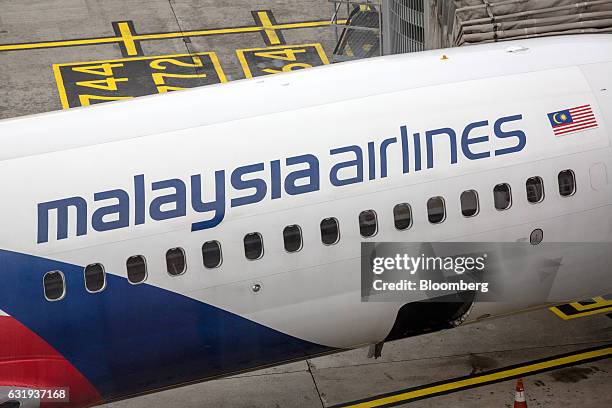 Malaysian Airlines Bhd. Aircraft stands on the tarmac at Kuala Lumpur International Airport in Sepang, Selangor, Malaysia, on Tuesday, Jan. 17, 2017....