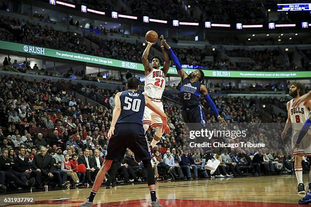 Dallas Mavericks guard Wesley Matthews guards Chicago Bulls forward Jimmy Butler while he takes a shot during the first half at the United Center...