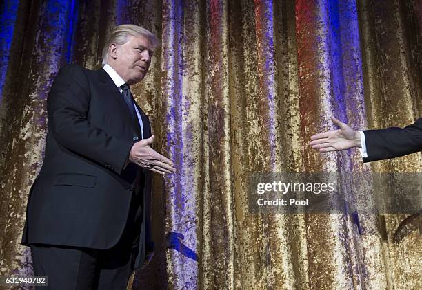 President-elect Donald Trump arrives onstage at the Chairman's Global Dinner, at the Andrew W. Mellon Auditorium on January 17, 2017 in Washington,...