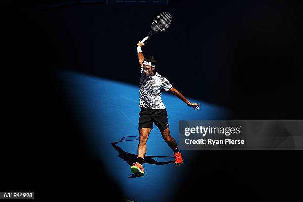 Roger Federer of Switzerland plays a backhand in his second round match against Noah Rubin of the United States on day three of the 2017 Australian...