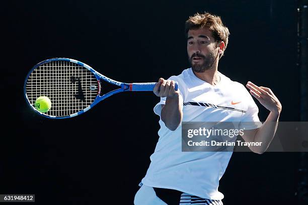 Feliciano Lopez and Marc Lopez of Spain compete in their first round match against Alexandr Dolgopolov of the Ukraine and Gerald Melzer of Austria on...