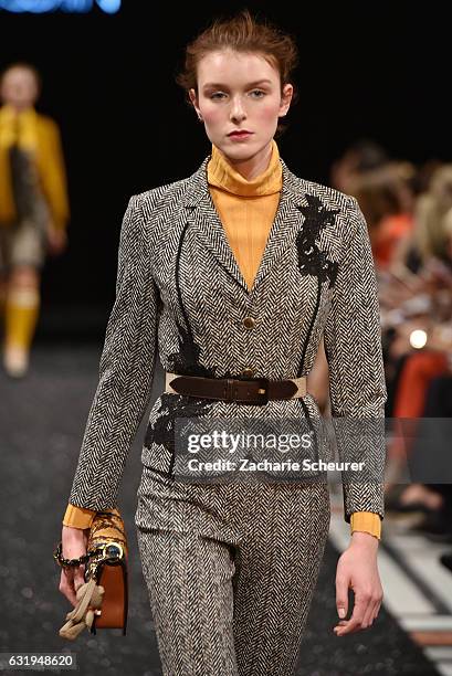 Model walks the runway at the Marc Cain fashion show A/W 2017 on January 17, 2017 in Berlin, Germany.