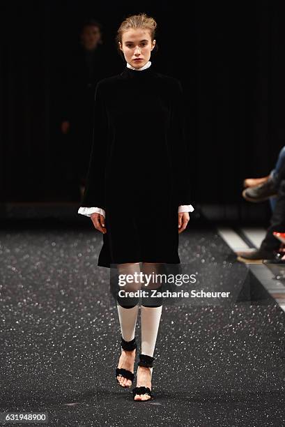 Model walks the runway at the Marc Cain fashion show A/W 2017 on January 17, 2017 in Berlin, Germany.