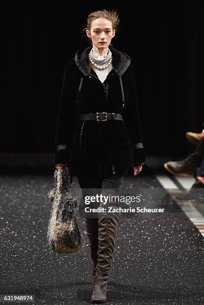 Model walks the runway at the Marc Cain fashion show A/W 2017 on January 17, 2017 in Berlin, Germany.