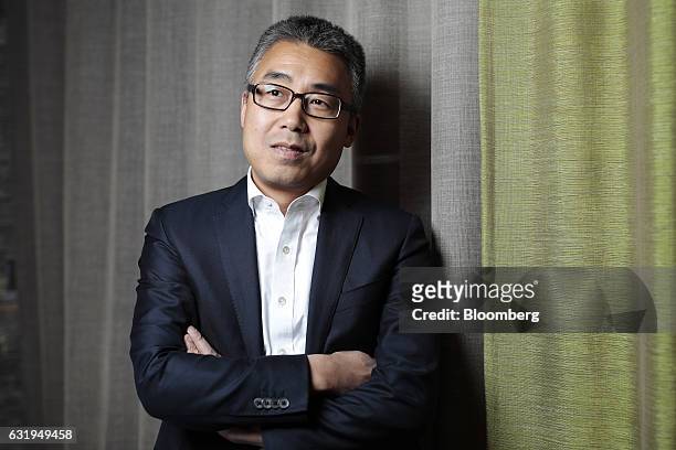 Ruigang Li, chairman of CMC Holdings Limited, poses for a photograph following an interview at the World Economic Forum in Davos, Switzerland, on...