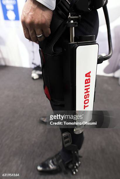 Booth attendant demonstrates Toshiba Corp.'s assist suit at the Robodex trade show on January 18, 2017 in Tokyo, Japan. Approximately 160 exhibitors...